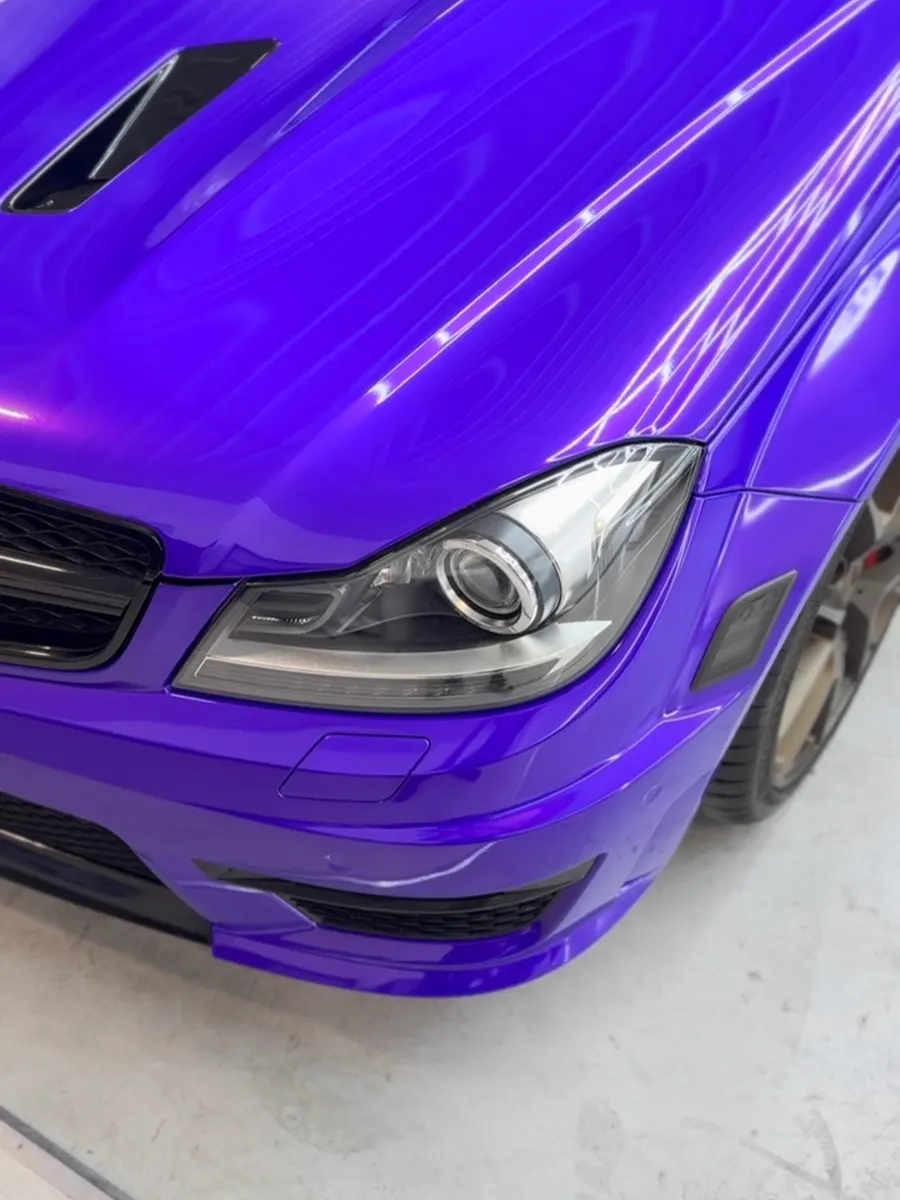 Mercedes C63 in 3M Plum Explosion, chrome delete in gloss black